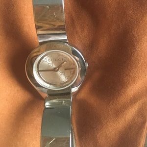 With Gucci bangle